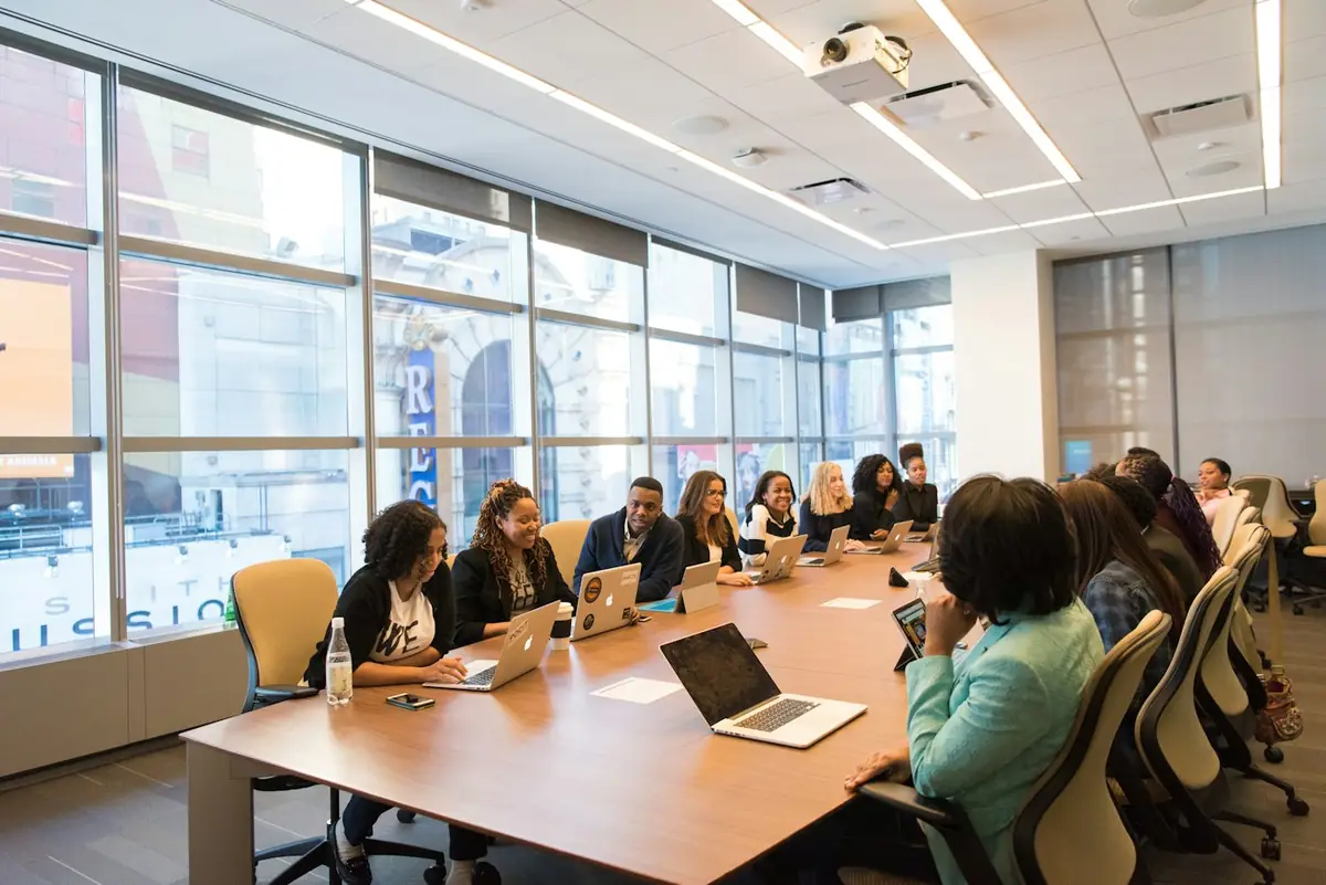 Consultants collaborating around a meeting table